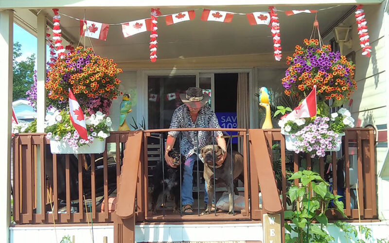 guy with dogs and canada flags